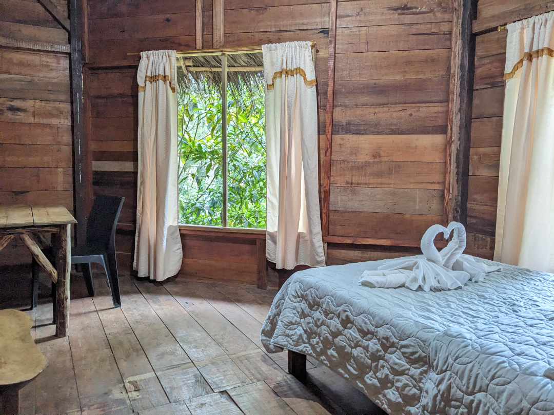 Lodging at Amarun Pakcha includes a double bed in private room with private bath includes a desk and wonderful views of the forest.